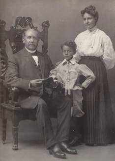 older black family posing for portrait