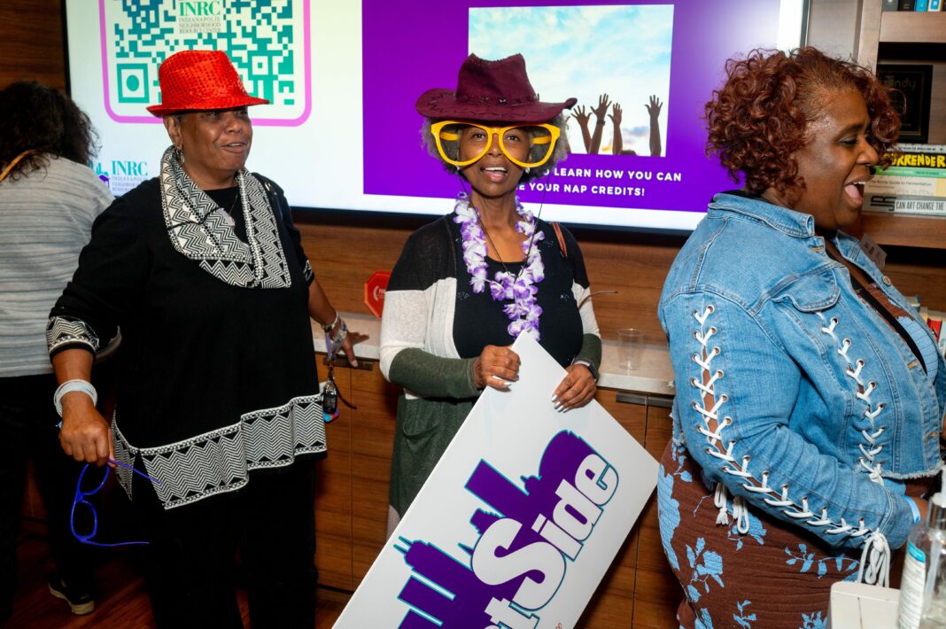 Three women dressed up for INRC's annual Jubilee