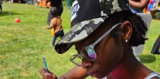 young girl decorates cupcake at the ultimate cupcake festival
