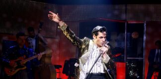 elvis dances and sings on stage