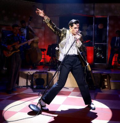 elvis dances and sings on stage
