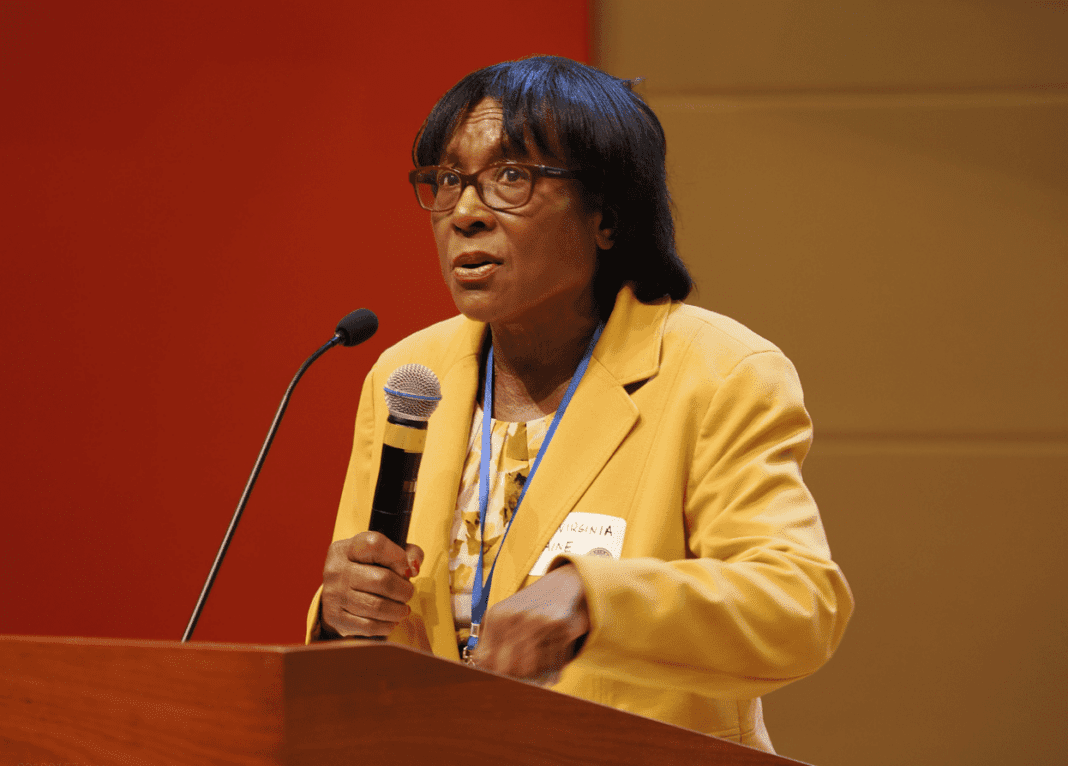 Dr. Virgina Caine speaks in front of crowd at Lead Summit