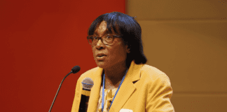 Dr. Virgina Caine speaks in front of crowd at Lead Summit