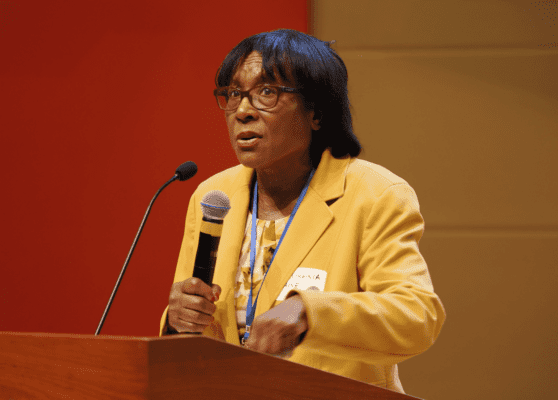 Dr. Virgina Caine speaks in front of crowd at Lead Summit
