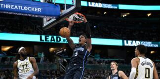 Orlando Magic player Paolo Banchero dunks against Indiana Pacers.