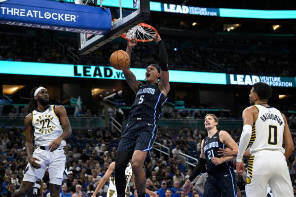 Orlando Magic player Paolo Banchero dunks against Indiana Pacers.