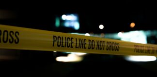 police tap to signify domestic gun violence
