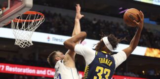 Pacers forward Myles Turner makes a dunk during Dallas Mavericks game.