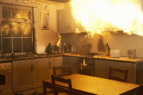Fire raging in domestic kitchen at night
