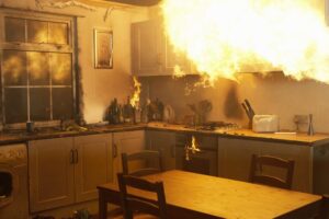 Fire raging in domestic kitchen at night
