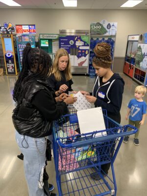 student from DREAM Alive shopping