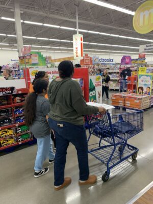 student from DREAM Alive shopping