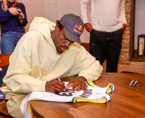 Indiana Pacers player Pascal Siakam signing apparel.