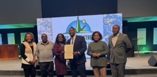Alongside city leaders, Pastor Kenneth Sullivan Jr. of New Direction Church announced the 38th Street Renaissance Campaign in partnership with the National Bank of Indianapolis during a press conference on Dec. 11. (Photo/Chloe McGowan)