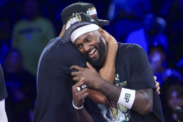 Bucks players embrace after 2024 NBA Cup Finals.