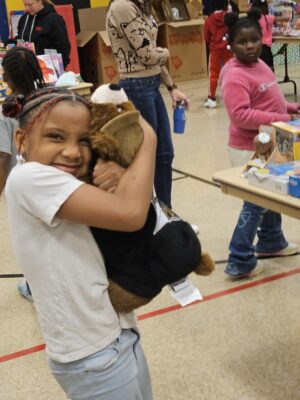 Girl hugging stuffed animal
