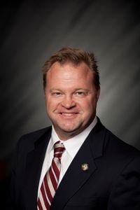 man in striped tie headshot