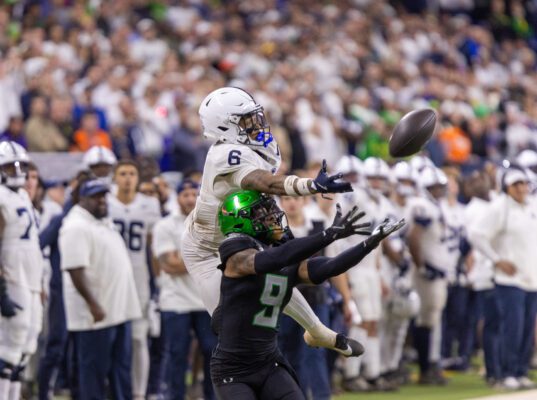 Player intercepts football for Oregon Ducks from Penn State during 2024 Big Ten Championship Game