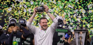 Oregon Ducks head football coach Dan Lanning celebrating after a 2024 Big Ten Championship Game win.