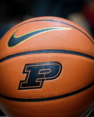 NCAA basketball with Purdue University logo.