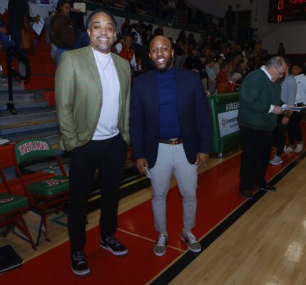 Anderson High School and Liberty Christian High School head coaches before a basketball game.
