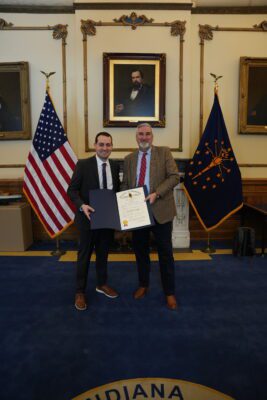 man receives award from governor