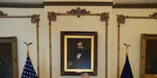 man receives award from governor