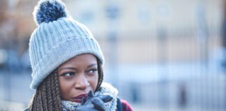 Shot of a beautiful young woman looking thoughtful on a wintery day outdoors
