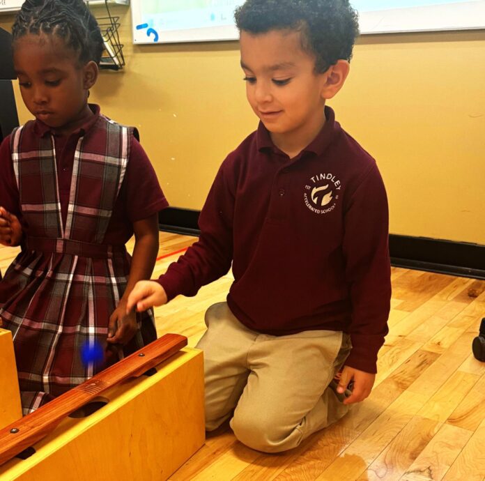 Students at Tindley Genesis Academy engage with the Orff Bass Bars in music class thanks to a grant from the Penrod Society. (Photo/Tindley Accelerated Schools)