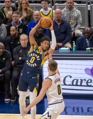 Indiana Pacers' Tyrese Haliburton with the ball during a NBA game against the Denver Nuggets.