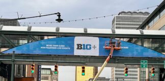 Workers help transform the city of Indianapolis into the home of the 2025 TIAA Big Ten Men's (and Women's) Basketball Tournament, during March 2025, in downtown Indianapolis, Indiana. (Photo/David Dixon)