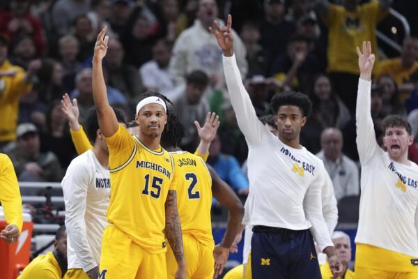 Michigan celebrating as they are on the verge of a win against Wisconsin Badgers during the 2025 TIAA Big Ten Men's Basketball Tournament Championship game.