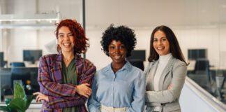 women business owners standing in unison.