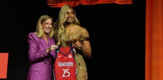 Kiki Iriafen and WNBA commissioner Cathy Engelbert during the 2025 WNBA Draft.