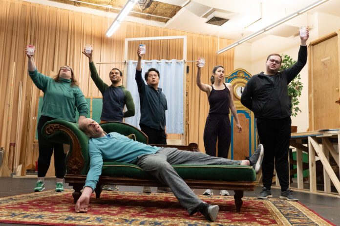The cast in rehearsal for the Indiana Repertory Theatre's 2025 production of "The Play That Goes Wrong."(Photo/Noelani Langille)
