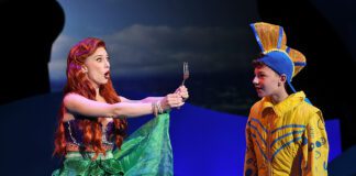 Ariel (Sarah Daniels) is delighted to discover a “dinglehopper” and shows it to Flounder (Asher Ortman) in Beef & Boards Dinner Theatre’s production of "Disney’s The Little Mermaid," now on stage through July 13. (Photo/Indy Ghost Light)