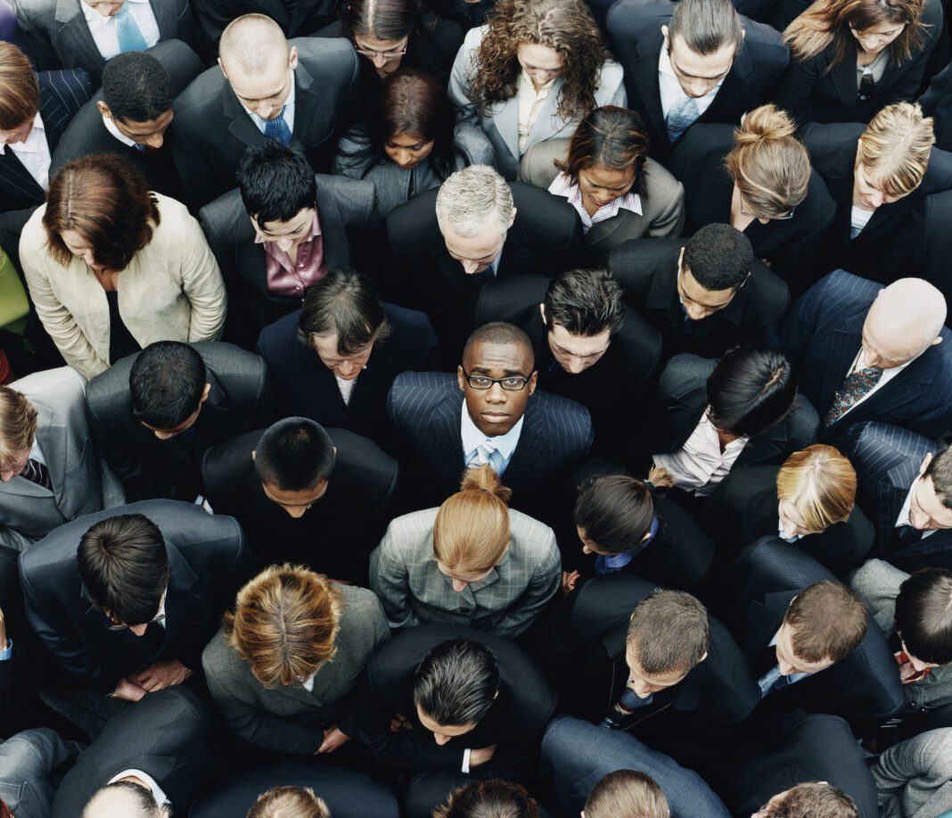 Getty Image of young Black future leader in a crowd of people.