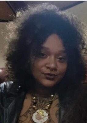 tattoo artist Kiarra Baxter.