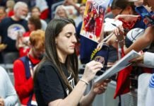 Indiana Fever guard Caitlin Clark (22) was sidelined with a left groin injury for the July 5, 2025 WNBA game against the Los Angeles Sparks in downtown Indianapolis, Indiana. (Photo/David Dixon)