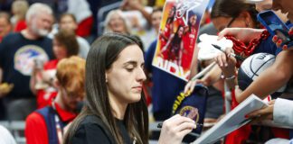 Indiana Fever guard Caitlin Clark (22) was sidelined with a left groin injury for the July 5, 2025 WNBA game against the Los Angeles Sparks in downtown Indianapolis, Indiana. (Photo/David Dixon)
