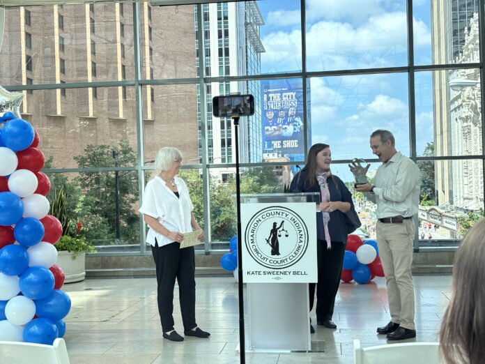 Marion County Clerk Kate Sweeney Bell recognized Adam Wilson and Margo Kelly with the Beacon of Freedom Award during the 60th Anniversary of the Voting Rights Act celebration on Aug. 6 at the Indianapolis Arts garden. (Photo/Chloe McGowan)