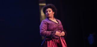 Indianapolis Recorder Arts & Culture Reporter Chloe McGowan starring in the Disney musical "Newsies" as Medda Larkin in November of 2025 in Indianapolis, Indiana.