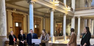 Representatives from a bipartisan coalition of more than 25 organizations, including Indiana Community Action Poverty Institute (ICAPI), gathered on Feb. 11 at the Indiana Statehouse in support of legislation to protect Hoosiers from harmful impacts of medical debt. (Photo/Chloe McGowan)