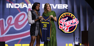 South Carolina guard Raven Johnson poses with WNBA commissioner Cathy Engelbert after being selected overall by the in the first round of the WNBA basketball draft Monday, April 13, 2026, in New York. (AP Photo/Pamela Smith)