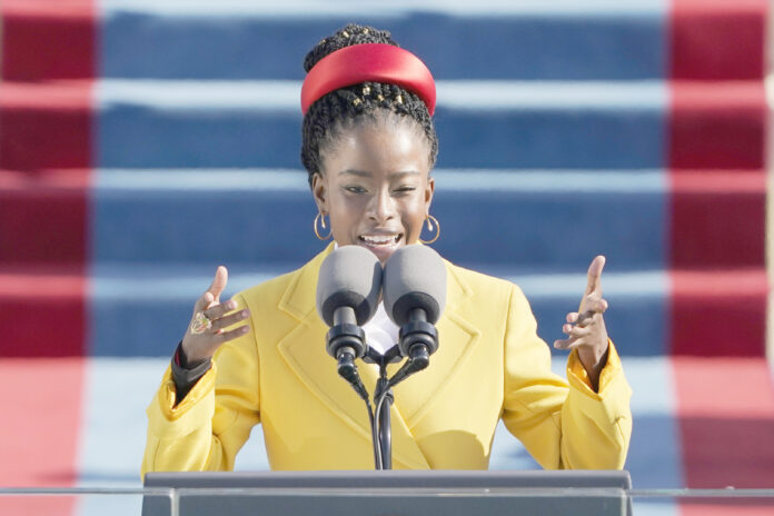 American poet Amanda Gorman reads a poem during the 59th Presidential Inauguration at the U.S. Capitol in Washington, Wednesday, Jan. 20, 2021. (AP Photo/Patrick Semansky, Pool)