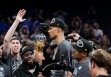 San Antonio Spurs forward Victor Wembanyama holds the MVP trophy as he celebrates with teammates after Game 7 of the Western Conference finals of the NBA basketball playoffs series win against the Oklahoma City Thunder, Saturday, May 30, 2026, in Oklahoma City. (AP Photo/Tony Gutierrez)