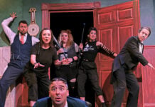Max (Joey Boos), front, falls to the stage floor after breaking through a stuck set door in Beef & Boards Dinner Theatre’s production of “The Play That Goes Wrong.” (Photo/Indy Ghost Light)