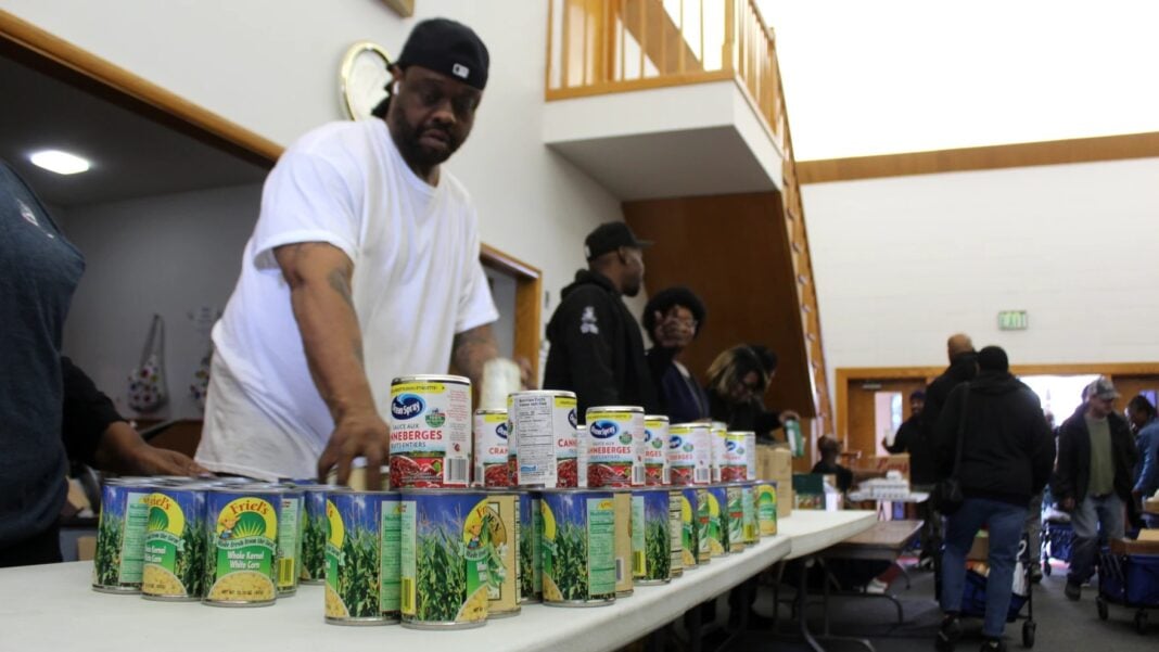 wfyi photo Volunteers stack canned goods at Fountain Square Church of Christ on the Southeast side of Indianapolis during a food distribution event Saturday, Nov. 8, 2025 organized by the city’s Office of Public Health and Safety. (Photo via WFYI)