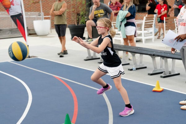 A young basketballer and fan taking part in "The Court is Hers" themed night on Aug. 14, 2026, at the Bicentennial Unity Plaza, in downtown Indianapolis, Indiana. (Photo provided/Elil Lilly and Company)