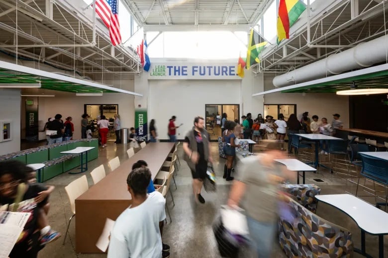 Global Prep Mirror Indy photo Families tour Global Prep Academy’s new middle school campus and meet teachers and staff during a ribbon-cutting celebration in Indianapolis on Aug. 5, 2026. The new campus will welcome students for the 2026-27 school year as the charter school expands to relieve overcrowding at its Riverside location. Credit: Doug McSchooler for Mirror Indy